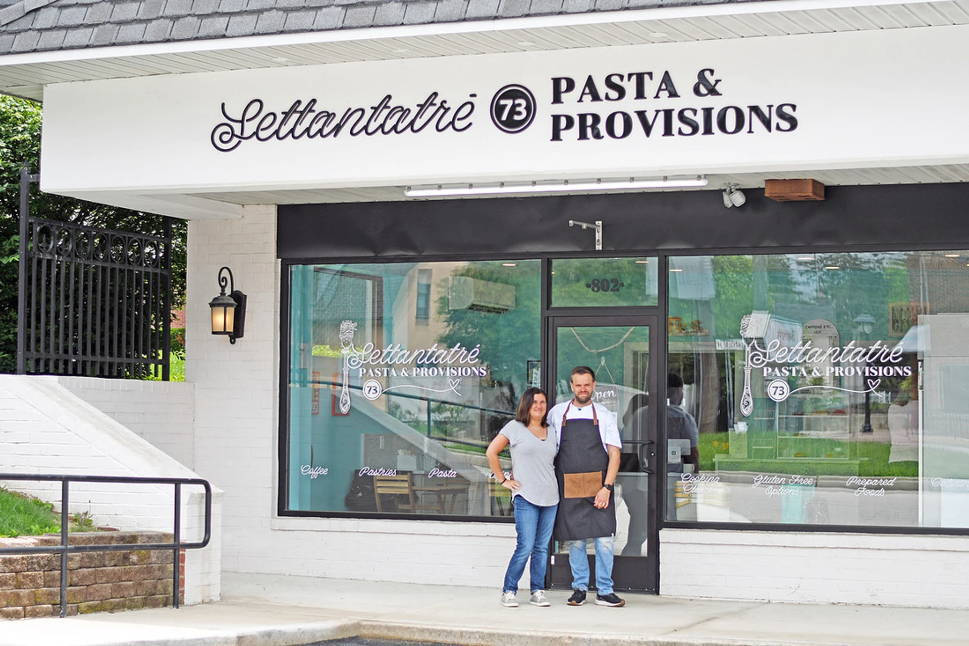 Fresh handmade pasta arranged on a flour-dusted wooden surface inside the Settantatré shop